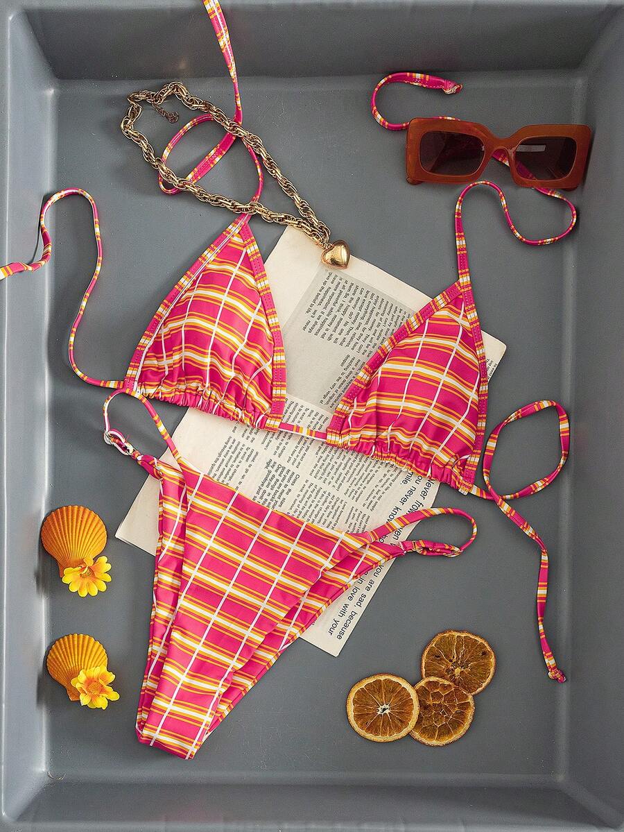 Multicolor bohemian bikini set for women featuring a backless halter top with knot details and high cut swimsuit bottoms.