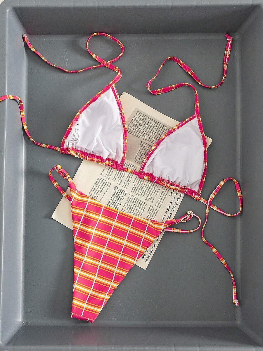 Multicolor bohemian bikini set for women featuring a backless halter top with knot details and high cut swimsuit bottoms.