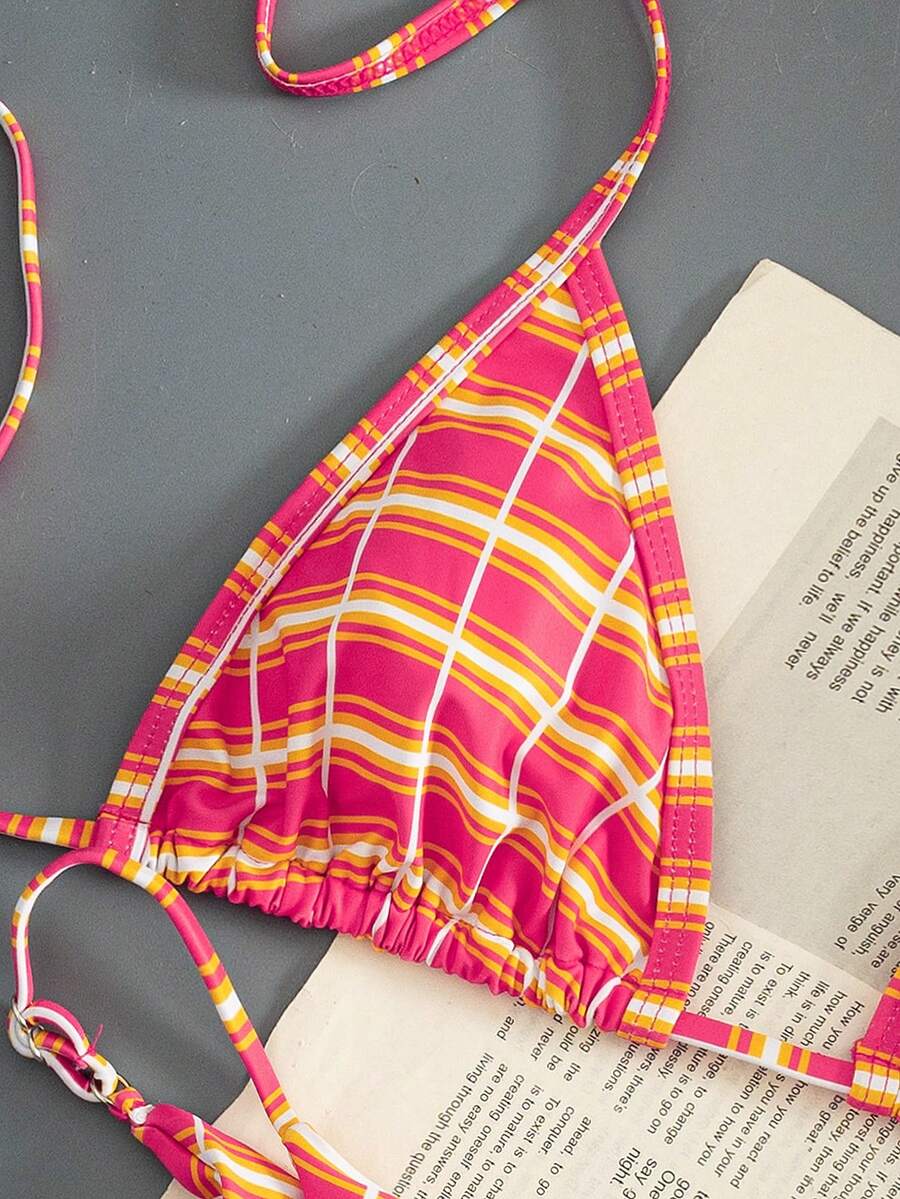 Multicolor bohemian bikini set for women featuring a backless halter top with knot details and high cut swimsuit bottoms.