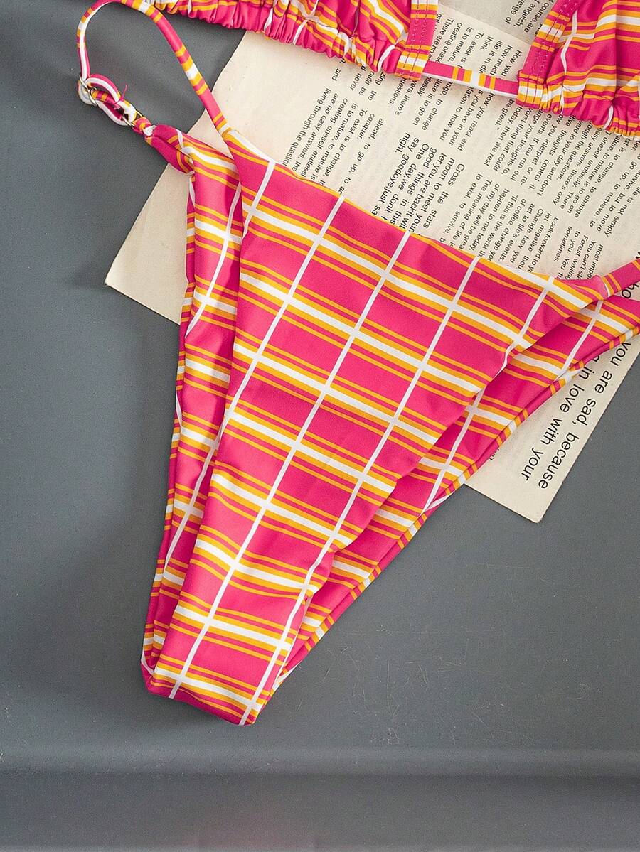 Multicolor bohemian bikini set for women featuring a backless halter top with knot details and high cut swimsuit bottoms.