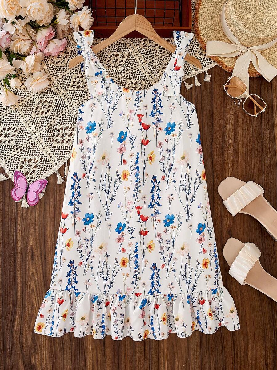 Tween girls apricot vacation midi dress featuring a round neck, cut out details, ruffle flounce accents, and geometric pattern.