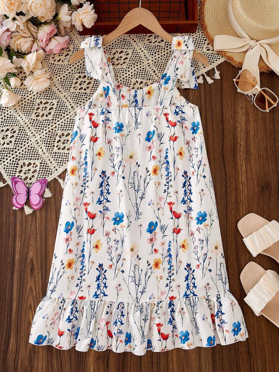 Tween girls apricot vacation midi dress featuring a round neck, cut out details, ruffle flounce accents, and geometric pattern.
