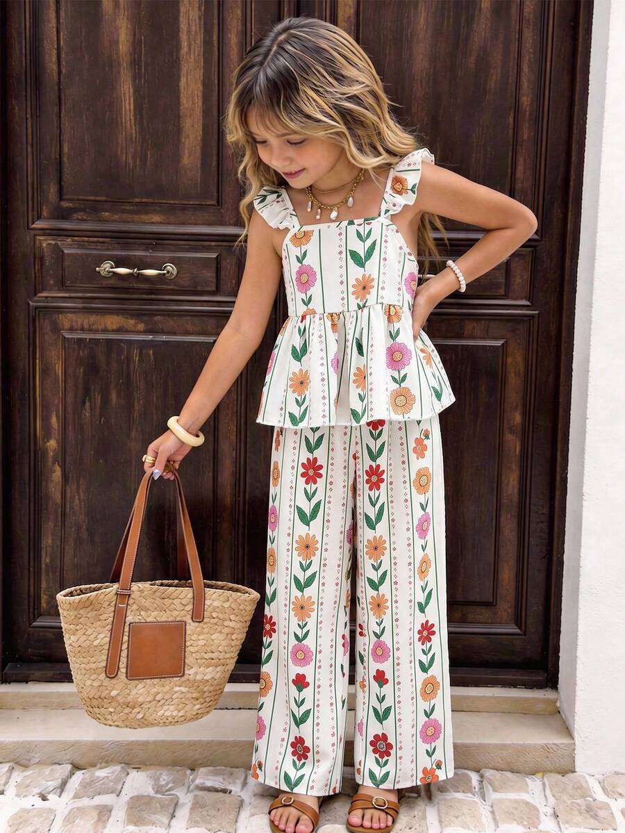 Tween girl wearing an apricot 2-piece outfit set featuring a shirred spaghetti strap short cami top and matching wide-leg long pants.