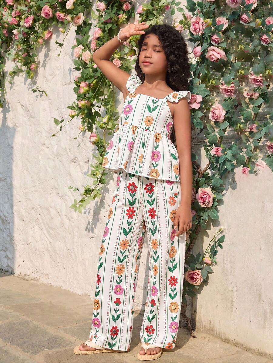 Tween girl wearing an apricot 2-piece outfit set featuring a shirred spaghetti strap short cami top and matching wide-leg long pants.