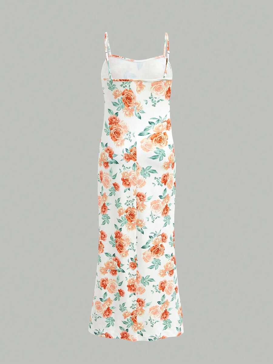Tween girls black cami midi dress featuring plant print, spaghetti straps, slim fit, and a flared hem.
