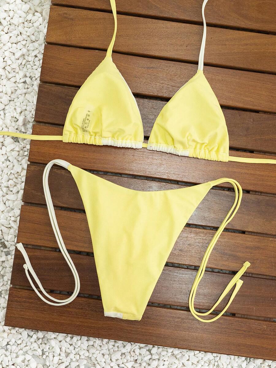 Women's triangle bikini set with contrast lace wireless bra top and ultra high waist tie side bottoms.