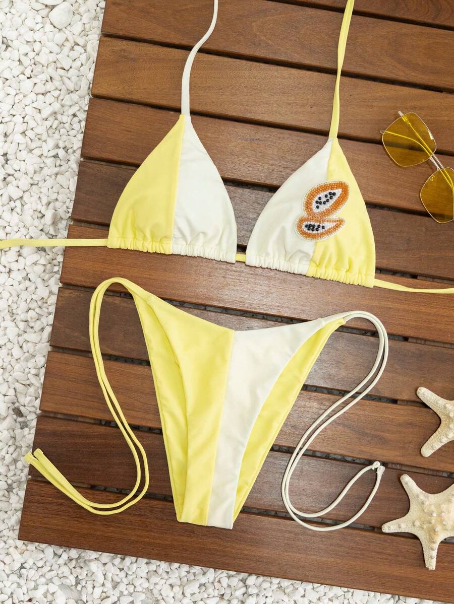 Women's triangle bikini set with contrast lace wireless bra top and ultra high waist tie side bottoms.