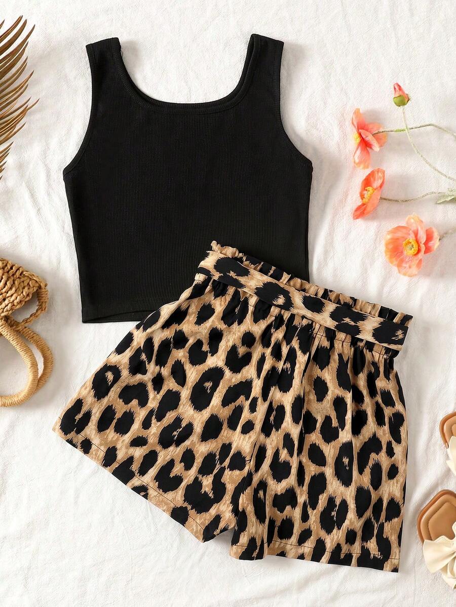 Tween girl wearing a casual 2-piece set featuring a black rib-knit scoop neck tank top and leopard print paperbag waist shorts with a matching belt.