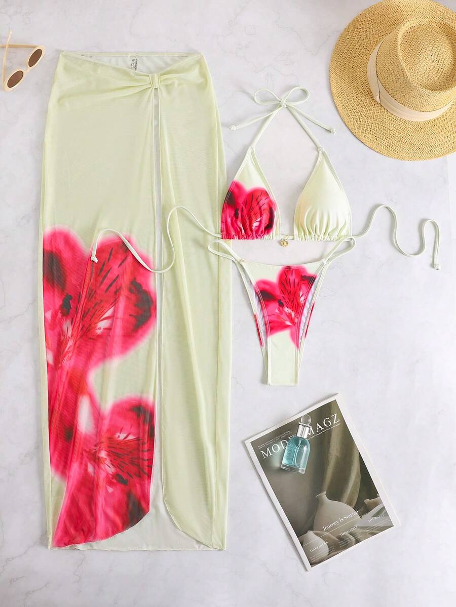 Women's 3-piece floral swimsuit set featuring a multicolor tie-back halter bikini top, low-waist bottoms, and a matching sheer mesh maxi skirt.
