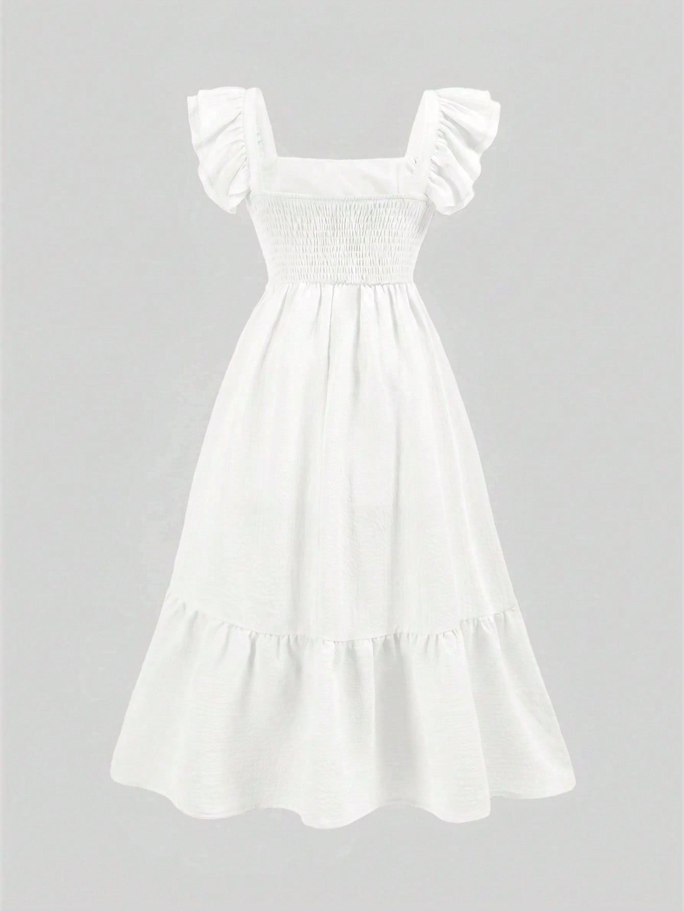 Tween girl multicolor floral vacation dress with square neck, ruffle details, shirred bodice, sleeveless A-line shape, high waist, and flounce hem.