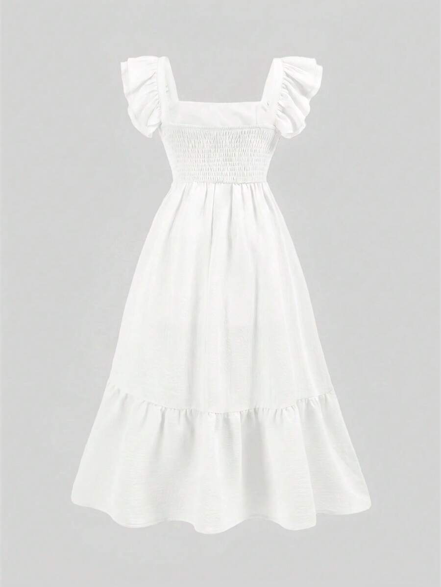 Blue floral print long vacation dress for tween girls featuring an A-line high waist silhouette with ruffle details and spaghetti straps.