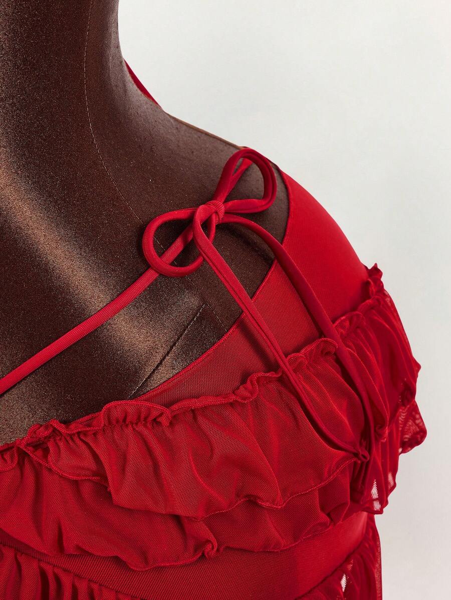 Women's 3-piece blue bikini swimwear set featuring a crop top with 3D rose accents, tie back detail, spaghetti straps, and tie-side bottoms.
