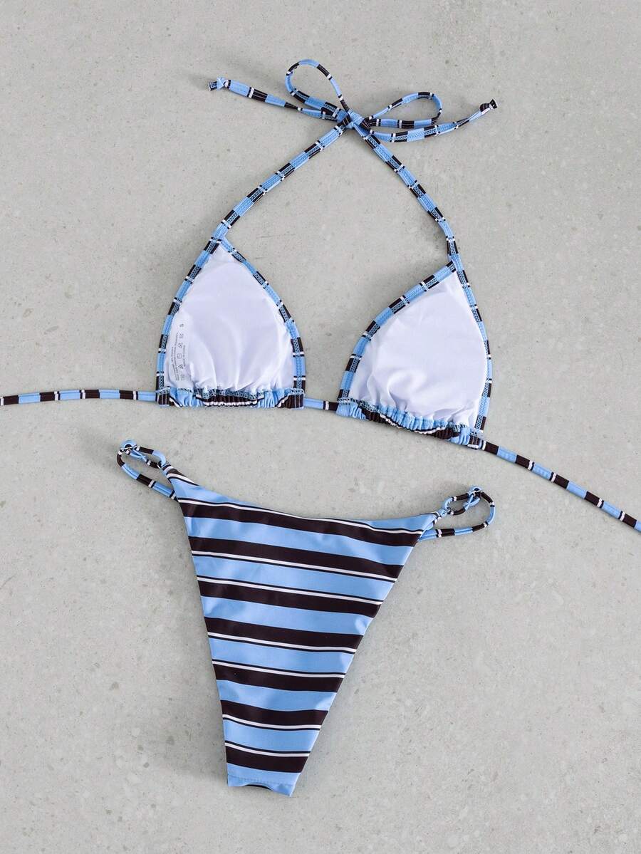 Multicolor bohemian bikini set for women featuring a backless halter top with knot details and high cut swimsuit bottoms.