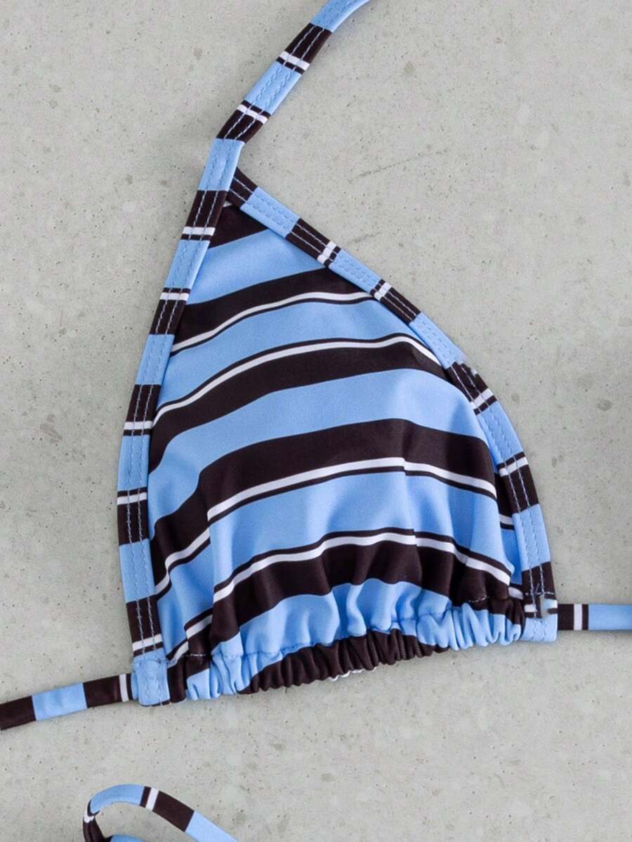 Multicolor bohemian bikini set for women featuring a backless halter top with knot details and high cut swimsuit bottoms.