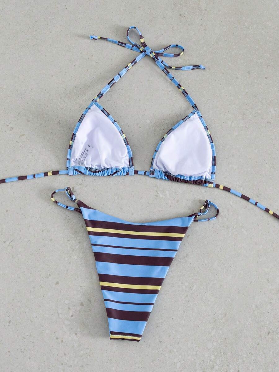 Multicolor bohemian bikini set for women featuring a backless halter top with knot details and high cut swimsuit bottoms.