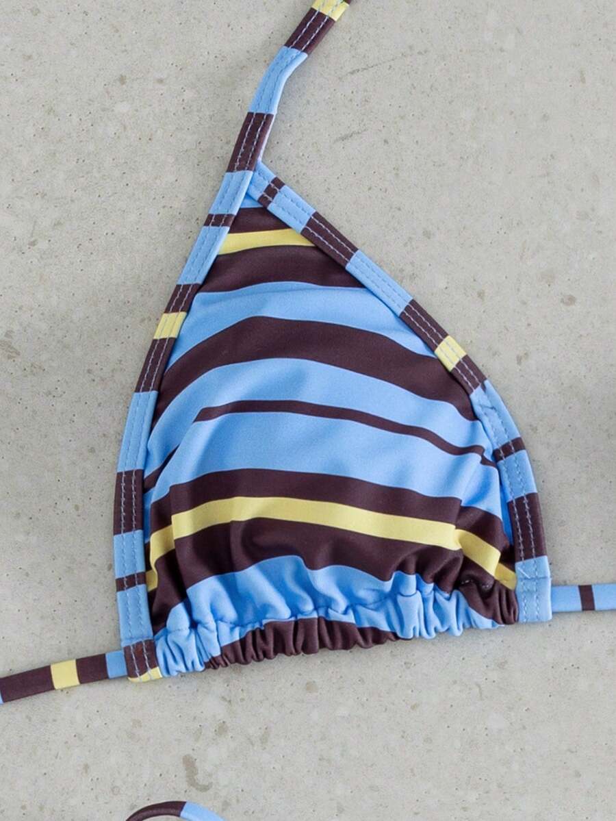 Multicolor bohemian bikini set for women featuring a backless halter top with knot details and high cut swimsuit bottoms.