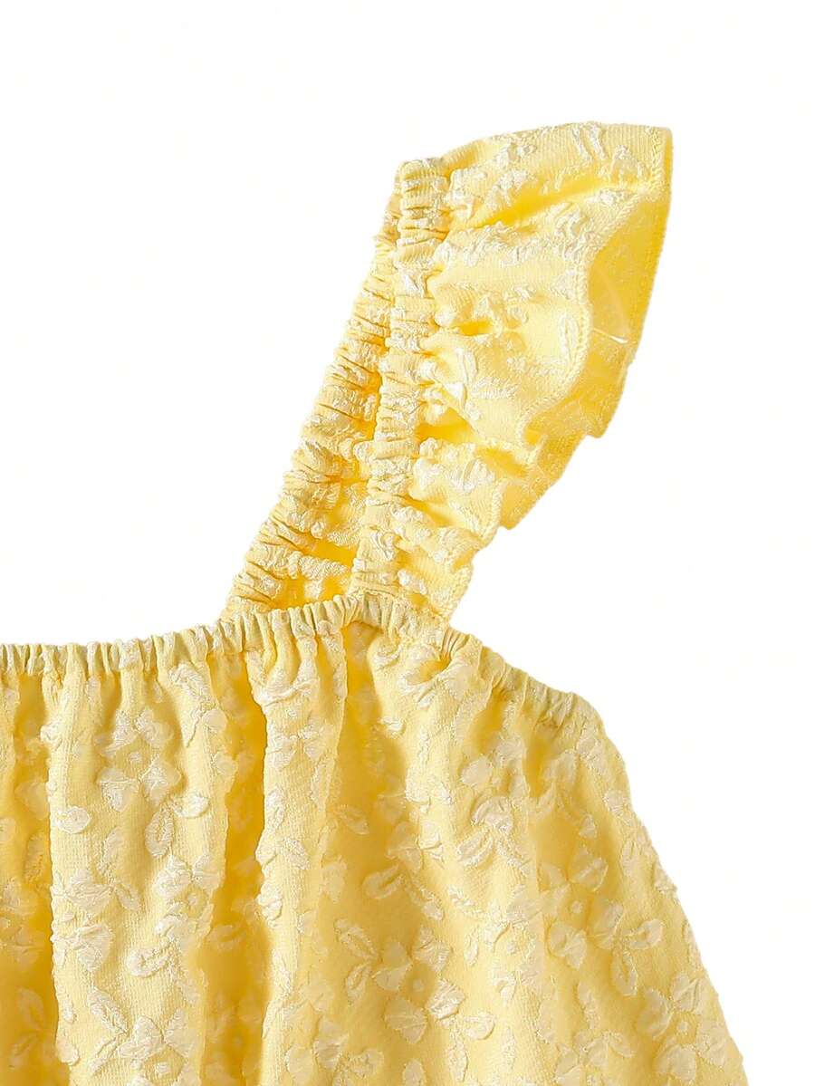Tween girl wearing a blue and white striped sleeveless top featuring embroidery details and ruffle trim with matching shorts.