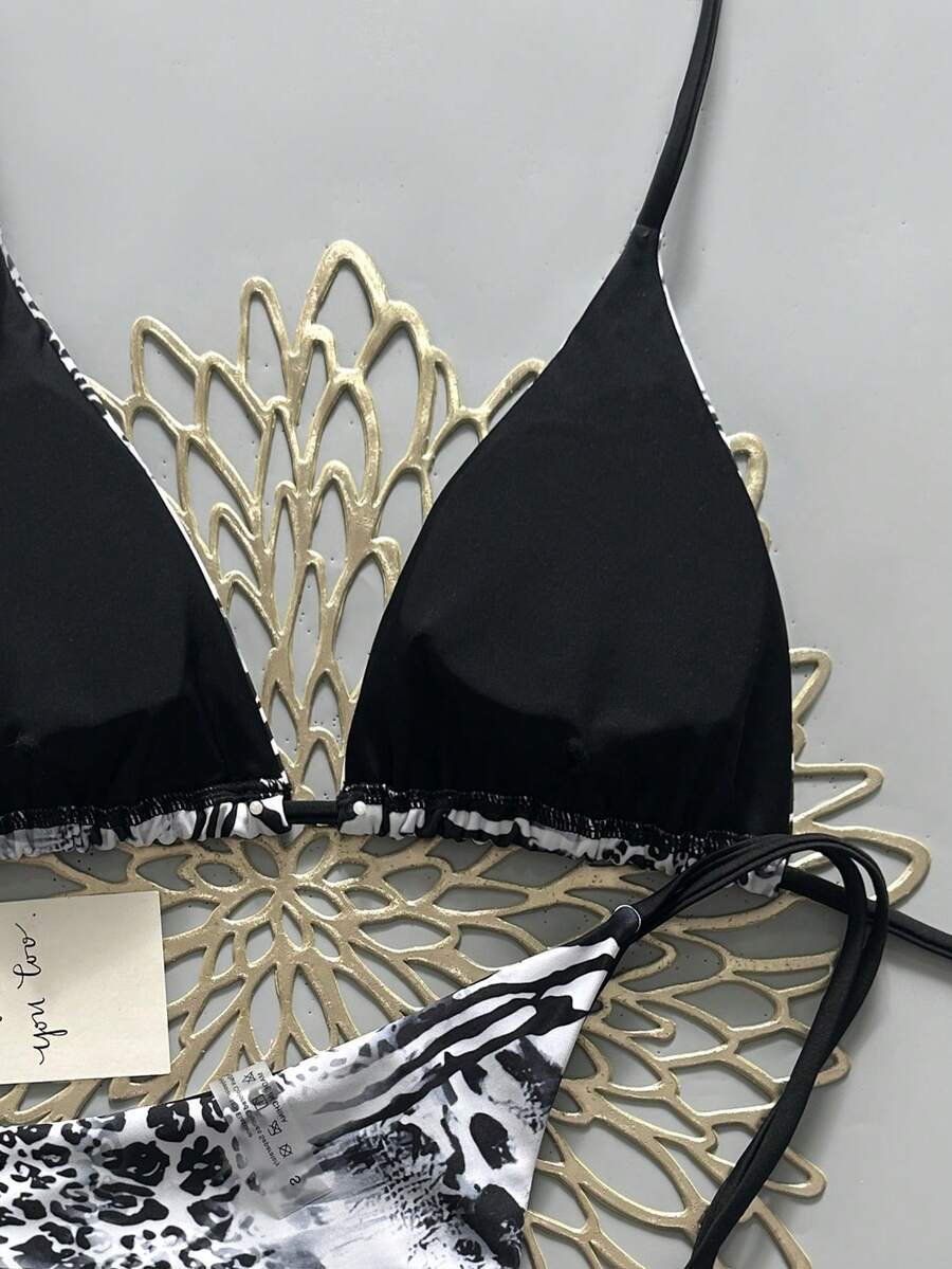 Women's vintage leopard print 2-piece bikini set featuring a high waist tie-side bottom and a halter neck triangle top.