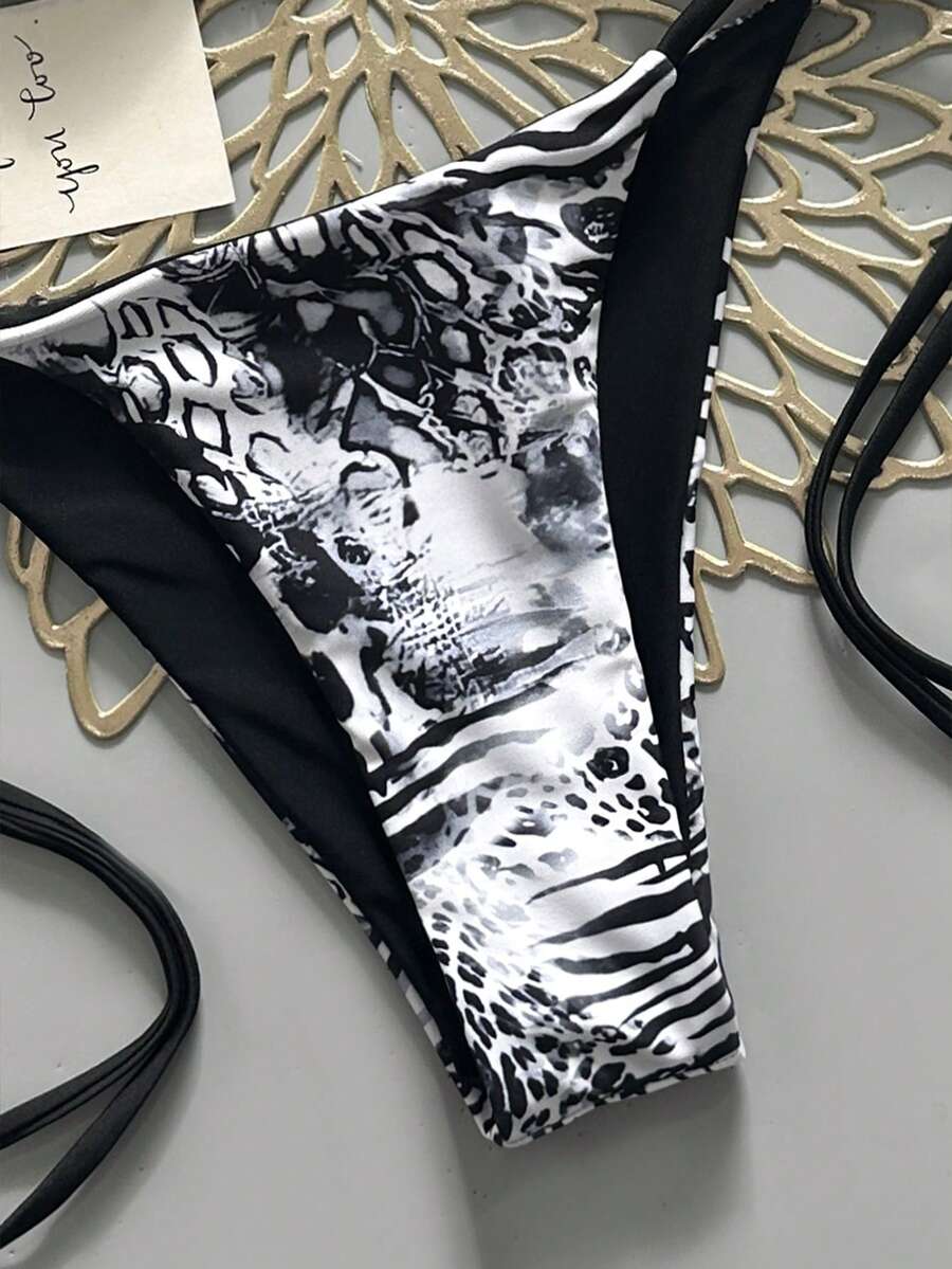 Women's vintage leopard print 2-piece bikini set featuring a high waist tie-side bottom and a halter neck triangle top.