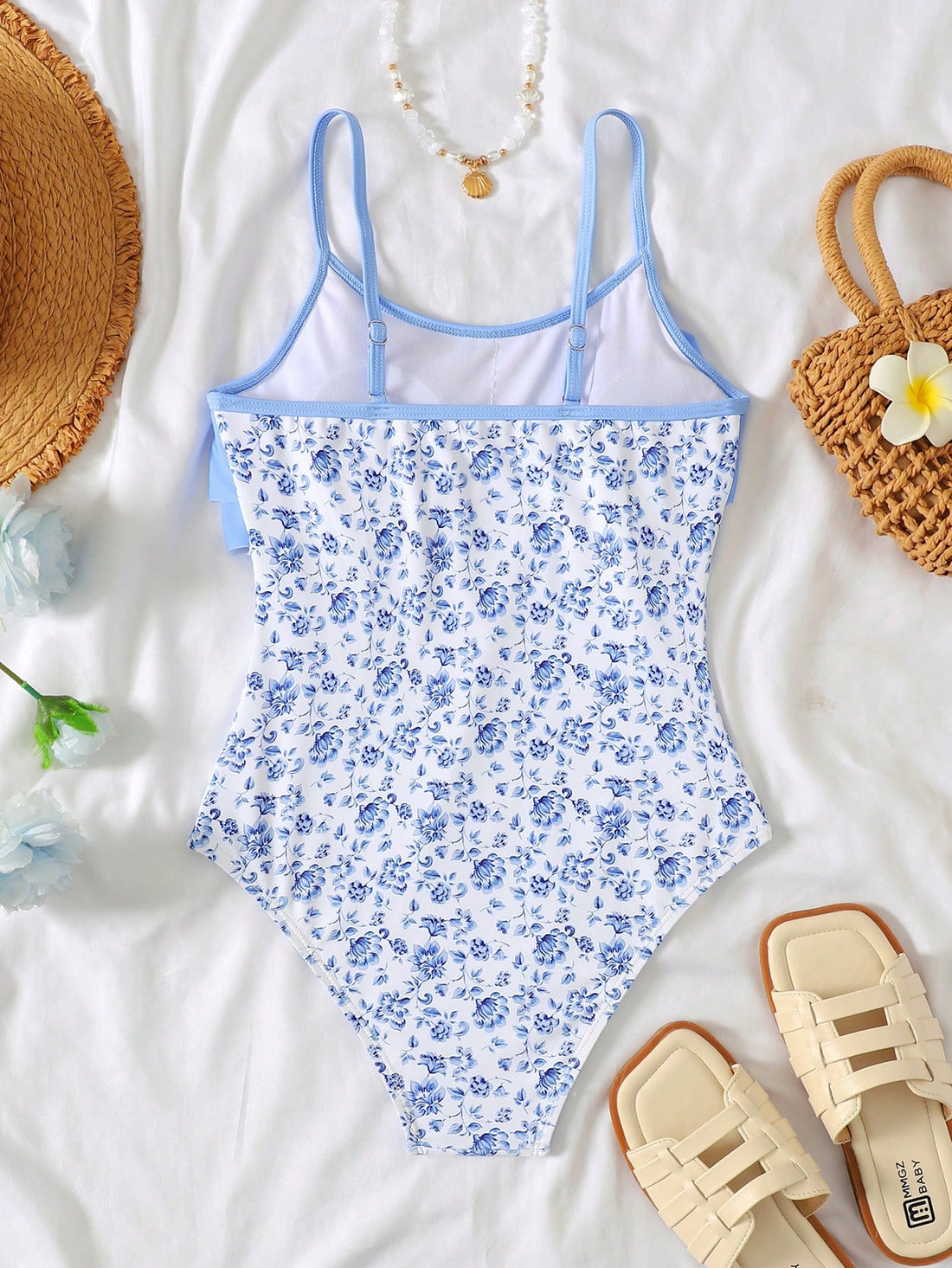 NEWSHEIN tween girls fitted one-piece swimsuit in blue and white plant pattern with ruffle tiered detail, spaghetti straps, and lined body for beach or resort wear