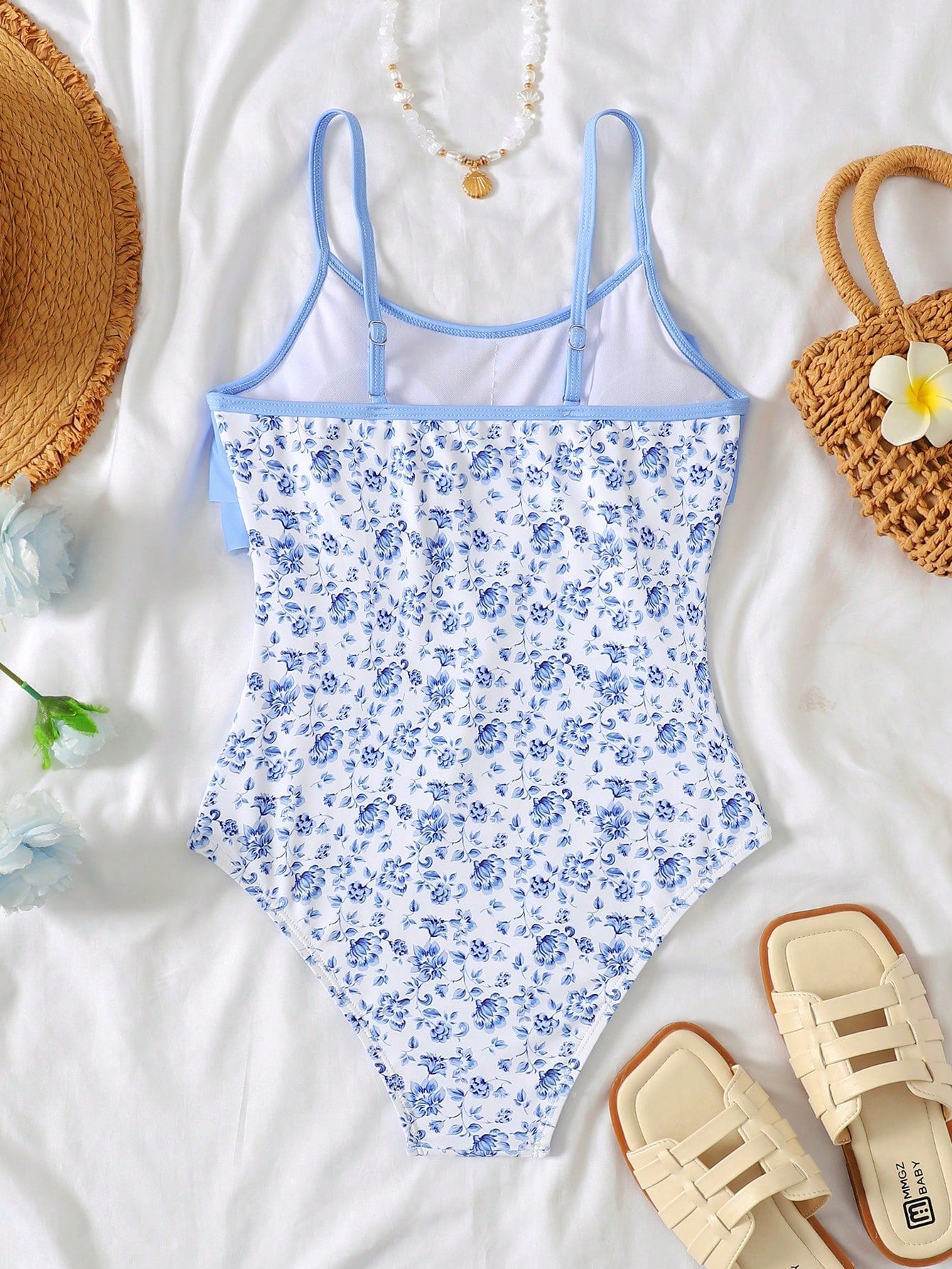 NEWSHEIN tween girls fitted one-piece swimsuit in blue and white plant pattern with ruffle tiered detail, spaghetti straps, and lined body for beach or resort wear