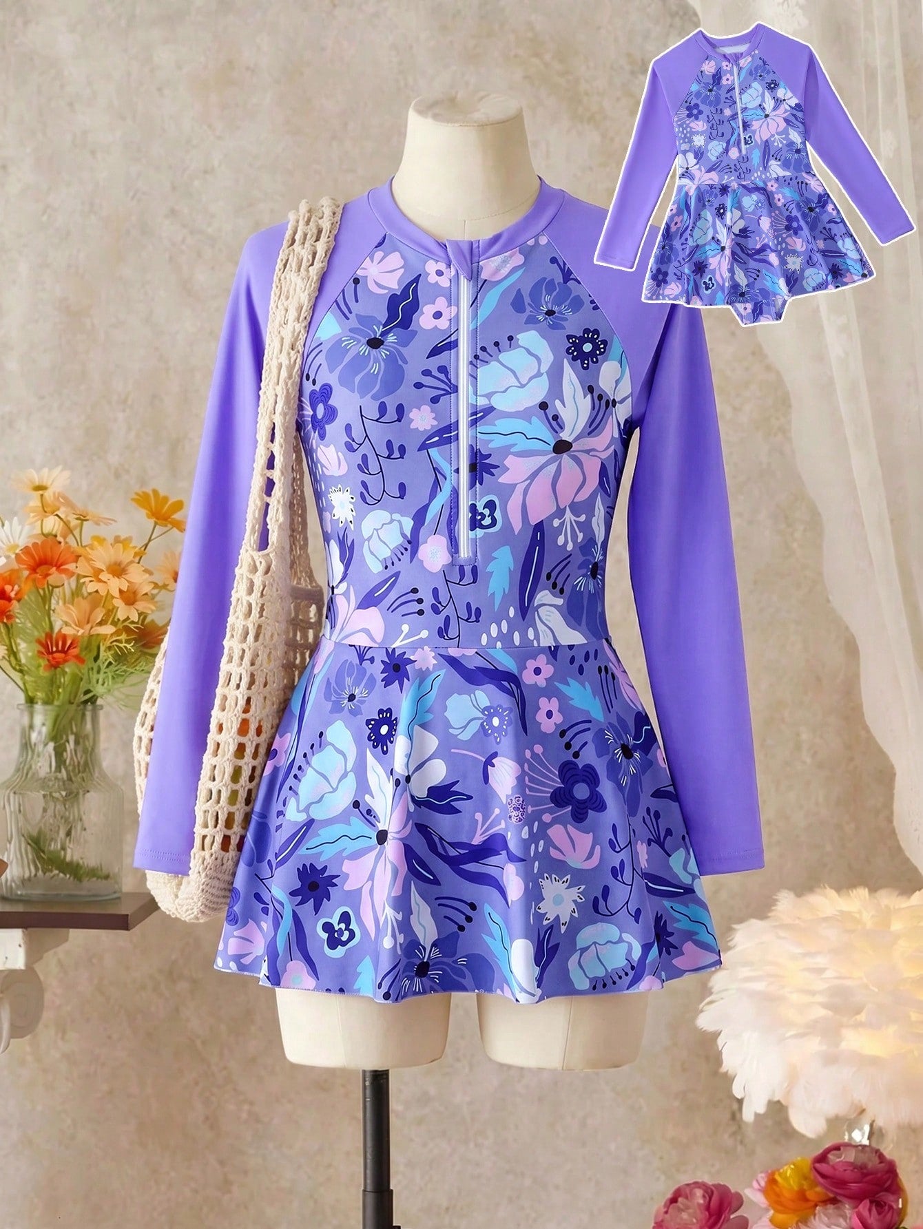 Purple tween girls one-piece swimsuit with graphic striped print, ruffle detail, round neck, and zipper closure for swimming and vacation wear
