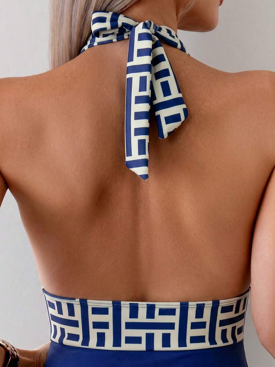 Apricot women's one-piece swimsuit featuring a halter neckline, backless tie-back detail, and ruched knitted fabric.