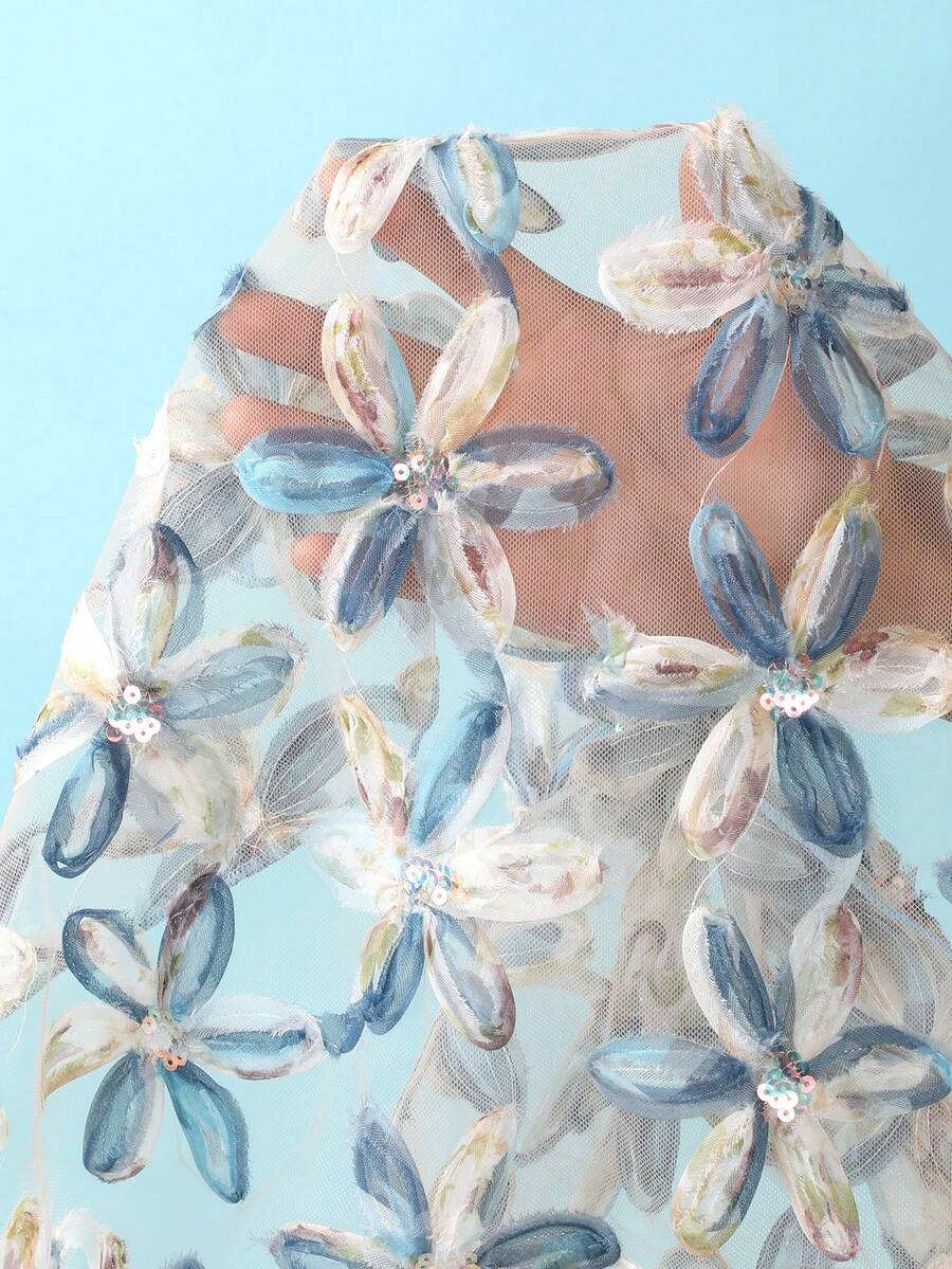 Women's 3-piece blue tropical shell print bikini set featuring a halter bralette top, low-waist tie-side bottom, and a matching sheer mesh cover-up skirt.