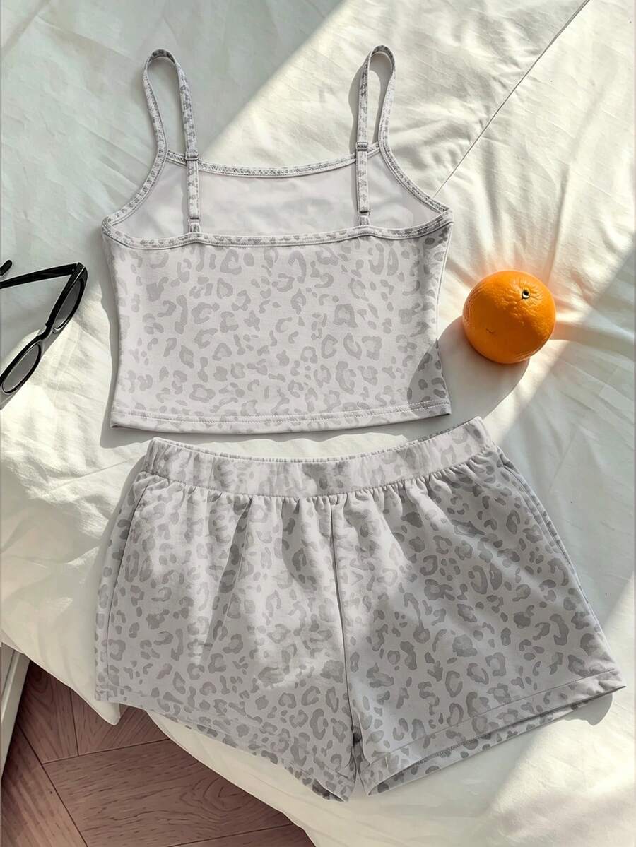 Tween girls summer 2-piece Hawaiian style outfit featuring a graphic print spaghetti strap camisole top with contrast piping and matching casual shorts.