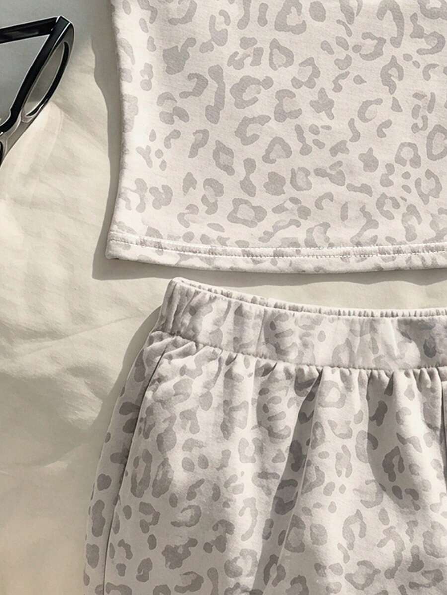 Tween girls summer 2-piece Hawaiian style outfit featuring a graphic print spaghetti strap camisole top with contrast piping and matching casual shorts.