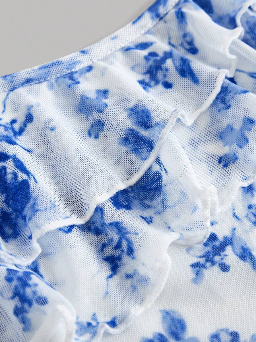 Tween girls blue 2-piece set featuring a short spaghetti strap lace tank top with asymmetrical lettuce trim and a long matching skirt.