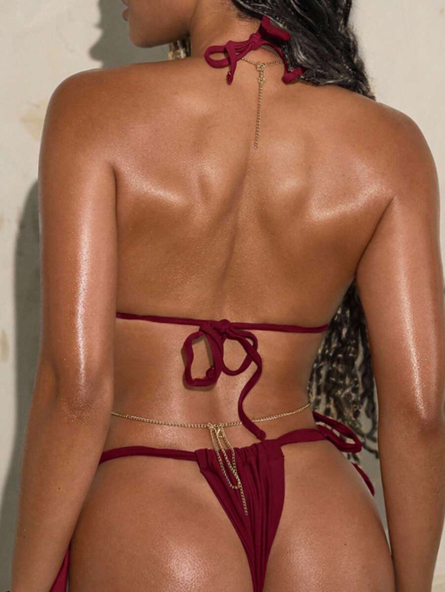 Army green high waist micro bikini swimsuit set for women featuring wireless spaghetti strap top with chain knot details and tie side thong bottoms.