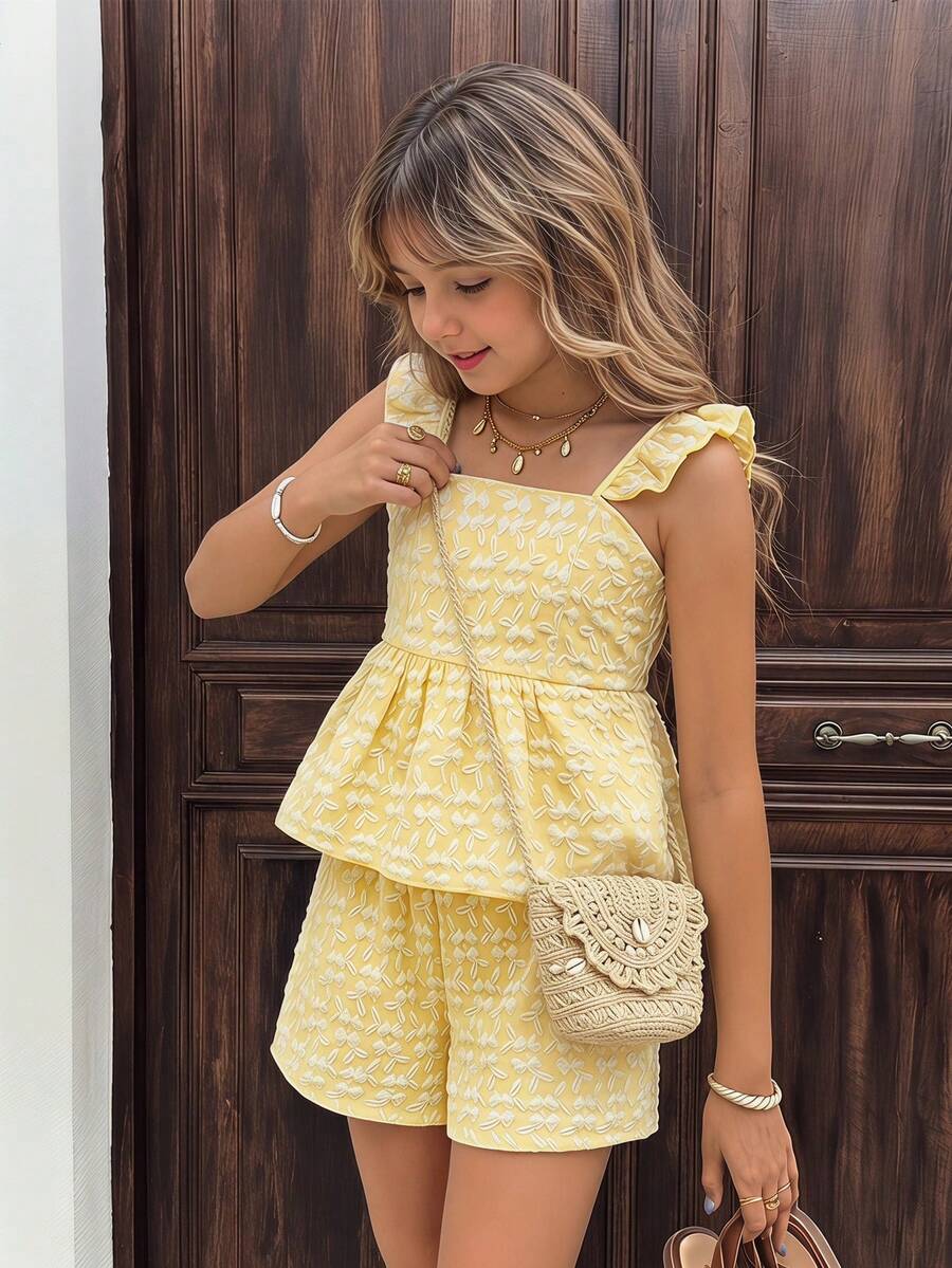 Tween girl wearing a blue and white striped sleeveless top featuring embroidery details and ruffle trim with matching shorts.