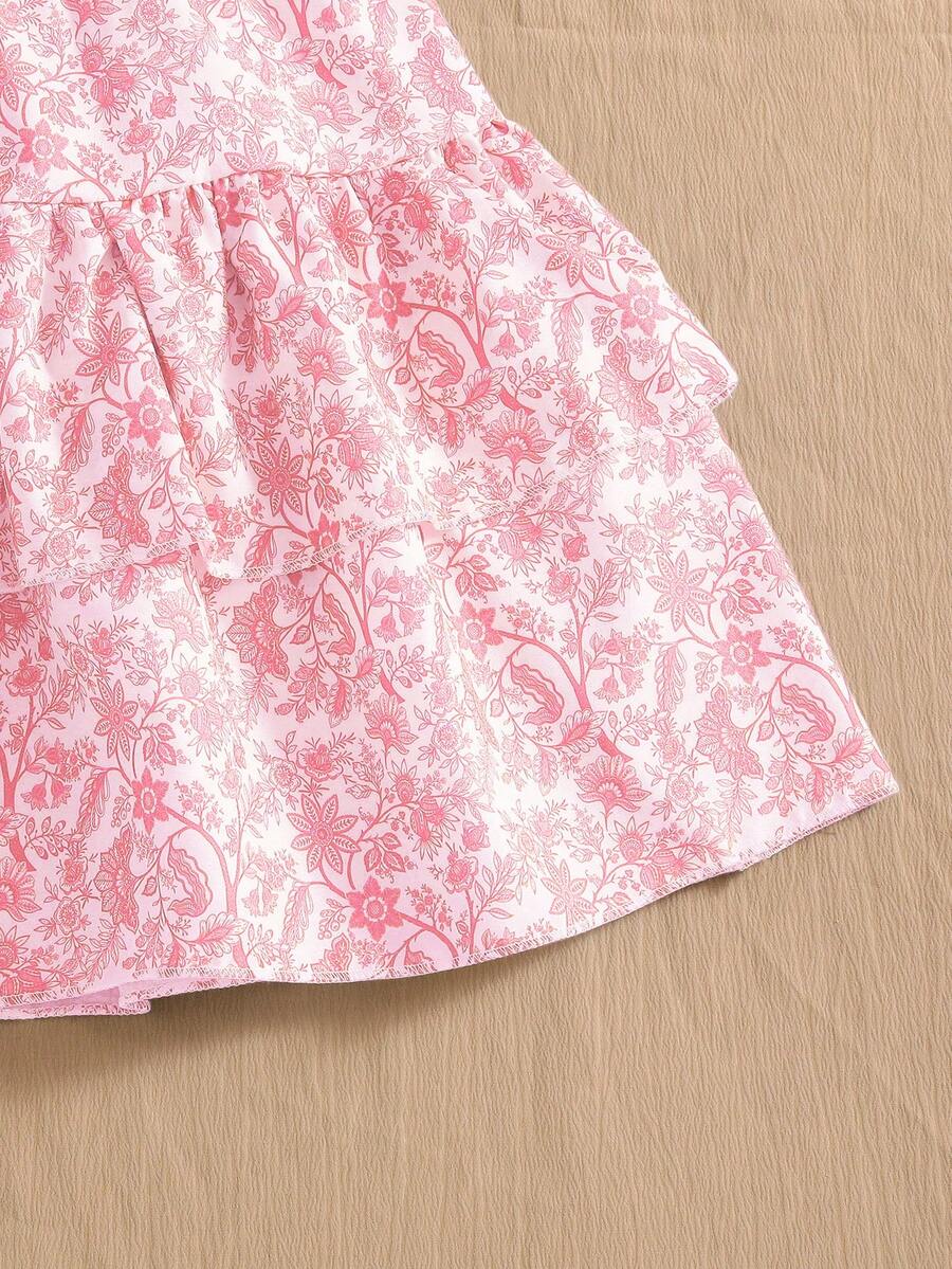 Light blue two-piece outfit set for tween girls with a sleeveless round neck vest top and a tiered ruffle cake skirt featuring a plant pattern.