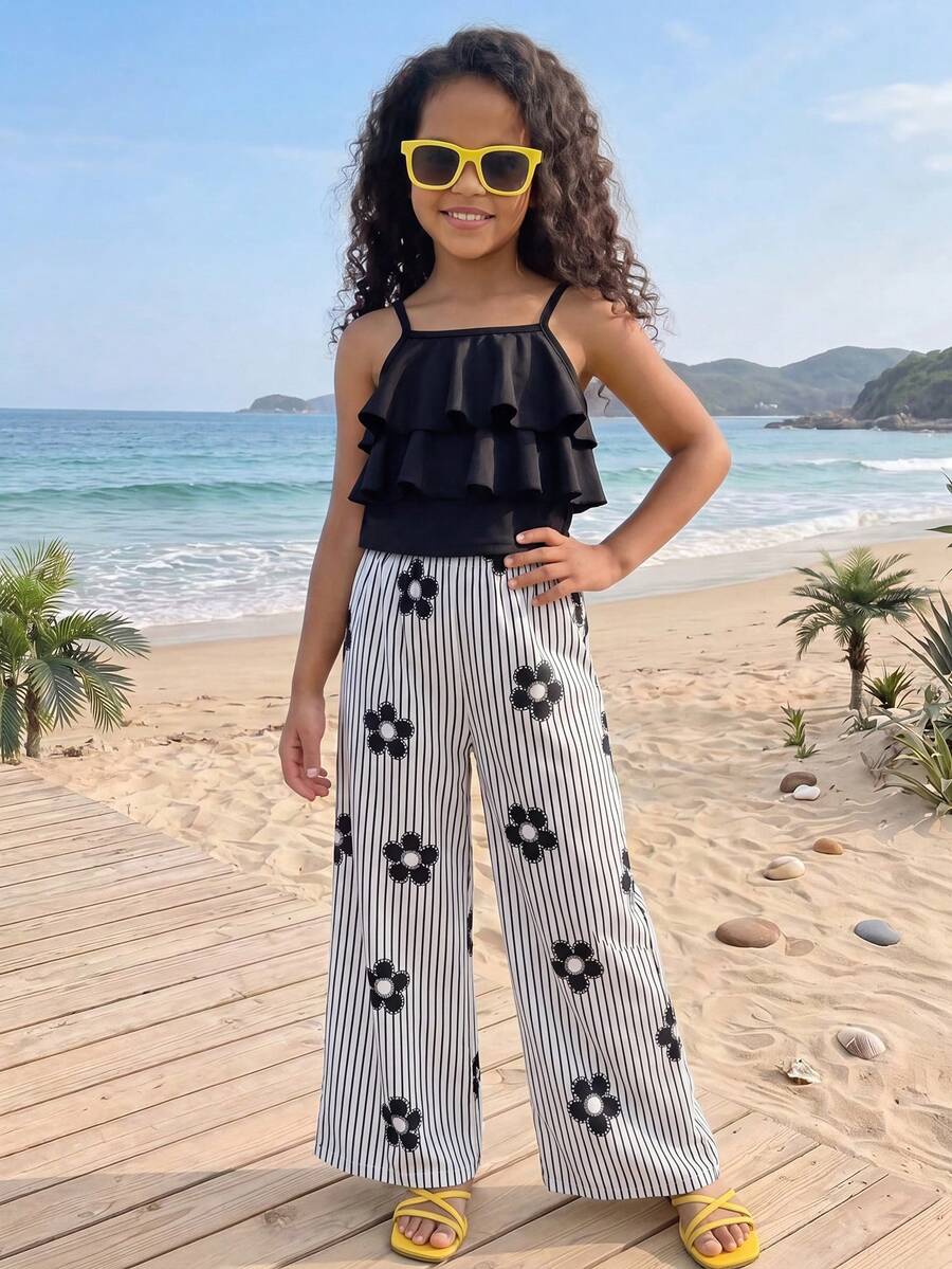 Tween girls blue 2-piece vacation outfit set featuring a tiered ruffle spaghetti strap camisole and loose high-waist pants.
