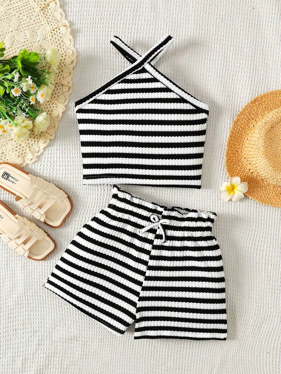 Black and white striped 2-piece set for tween girls featuring a halter sleeveless pullover top with criss-cross knot detail and matching paperbag waist shorts.