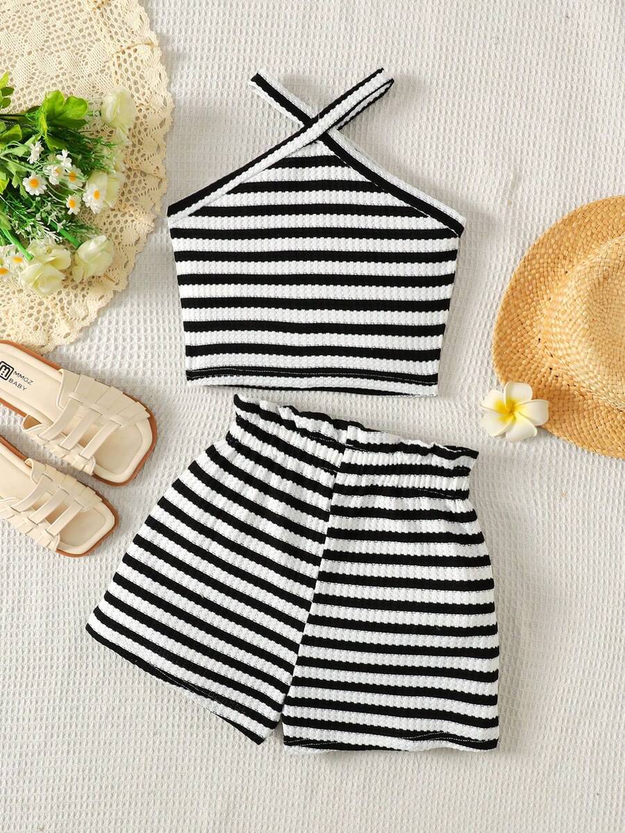 Black and white striped 2-piece set for tween girls featuring a halter sleeveless pullover top with criss-cross knot detail and matching paperbag waist shorts.