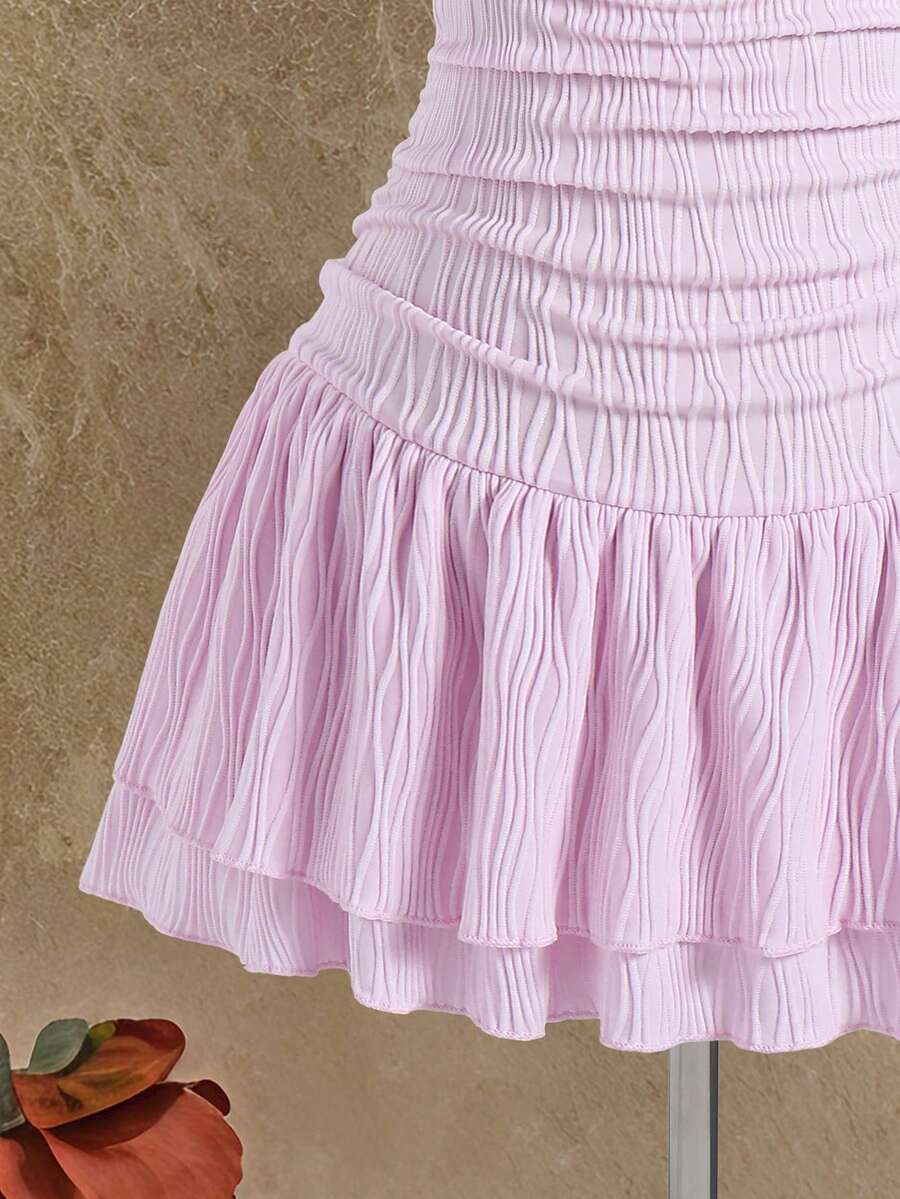 Tween girls apricot sleeveless halter mini dress with textured starfish and shell decor, shirred tiered layer, high waist, and flounce hem.