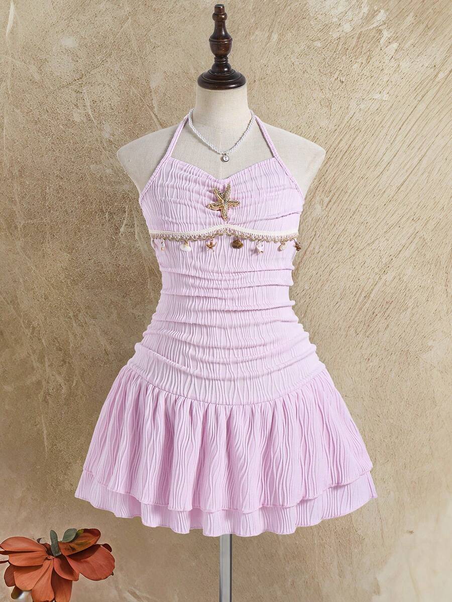 Tween girls apricot sleeveless halter mini dress with textured starfish and shell decor, shirred tiered layer, high waist, and flounce hem.