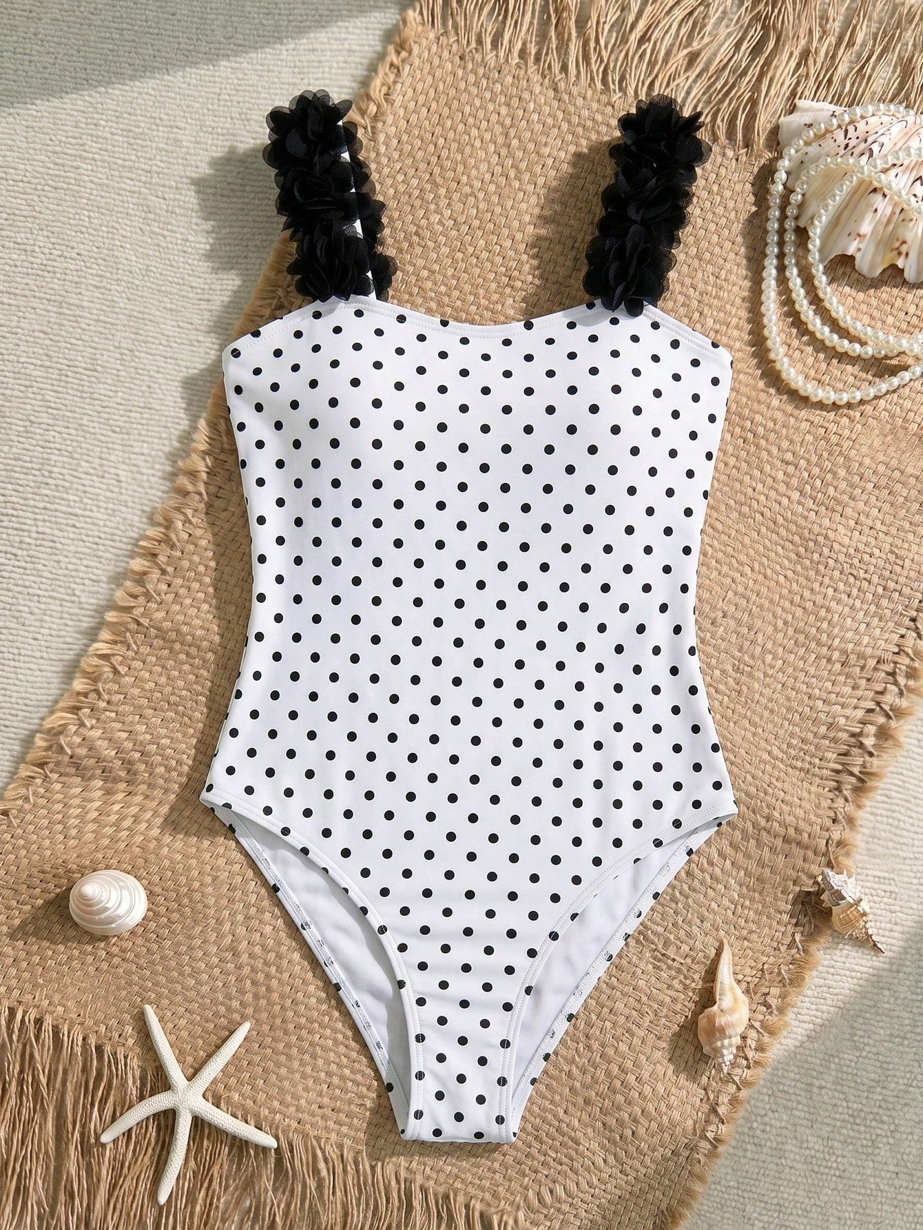 Tween girls one-piece swimsuit with 3D floral applique details, plant graphics, scoop neck, fitted shape, and lined body for beach and vacation wear.