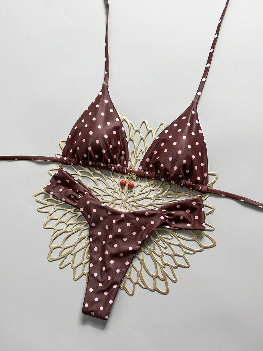 Women's 2-piece triangle cup bikini set in solid color featuring woven pearl shell decoration, halter neckline, and high-waist side-tie ruched bottoms.
