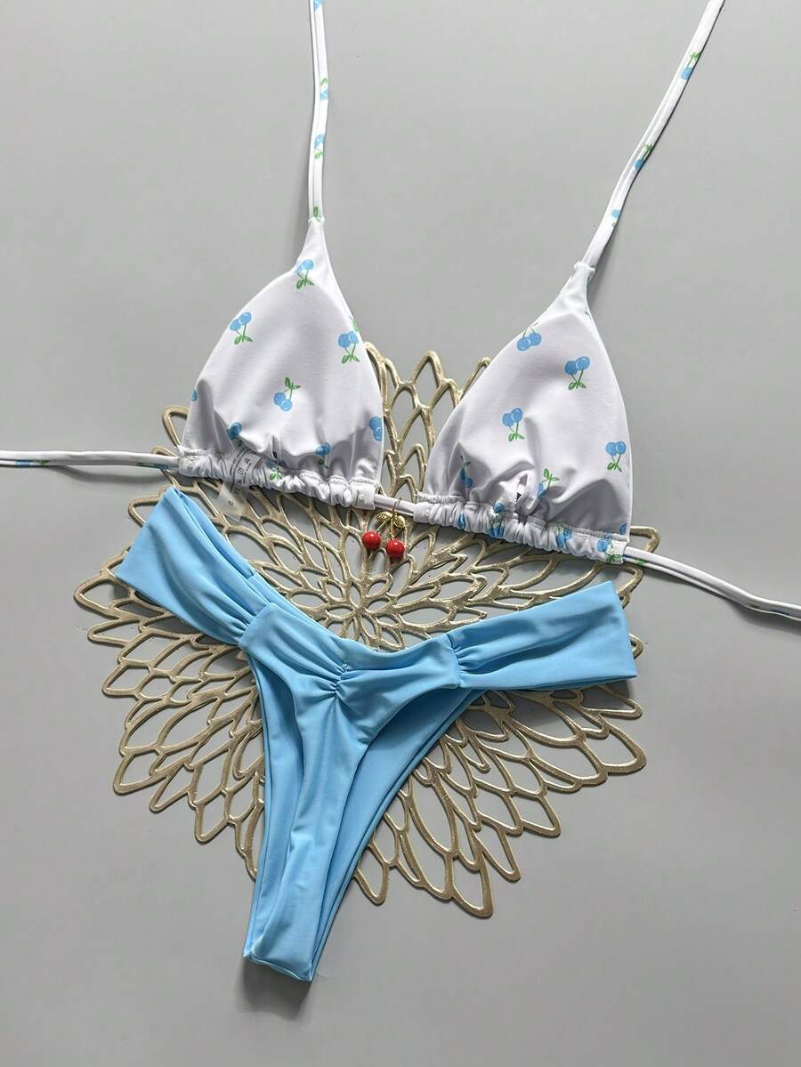 Women's 2-piece triangle cup bikini set in solid color featuring woven pearl shell decoration, halter neckline, and high-waist side-tie ruched bottoms.