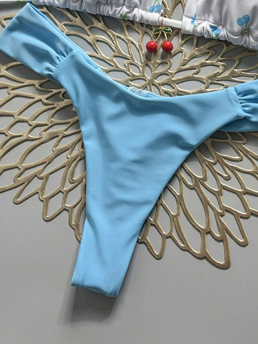 Women's 2-piece triangle cup bikini set in solid color featuring woven pearl shell decoration, halter neckline, and high-waist side-tie ruched bottoms.