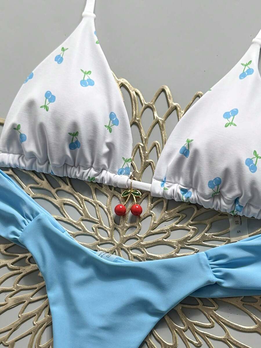 Women's 2-piece triangle cup bikini set in solid color featuring woven pearl shell decoration, halter neckline, and high-waist side-tie ruched bottoms.
