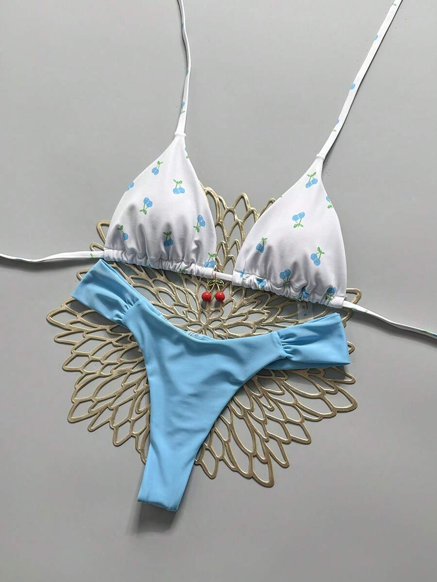 Women's 2-piece triangle cup bikini set in solid color featuring woven pearl shell decoration, halter neckline, and high-waist side-tie ruched bottoms.