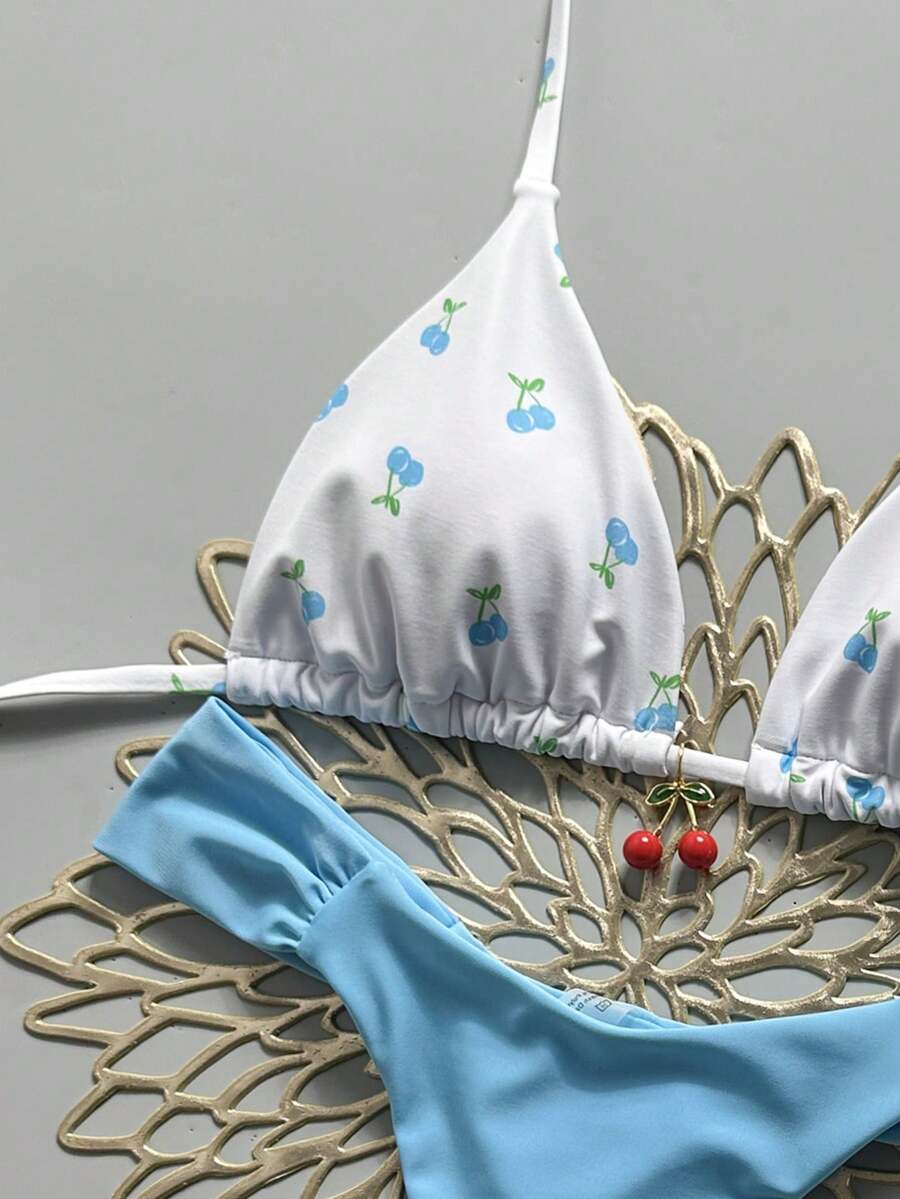 Women's 2-piece triangle cup bikini set in solid color featuring woven pearl shell decoration, halter neckline, and high-waist side-tie ruched bottoms.