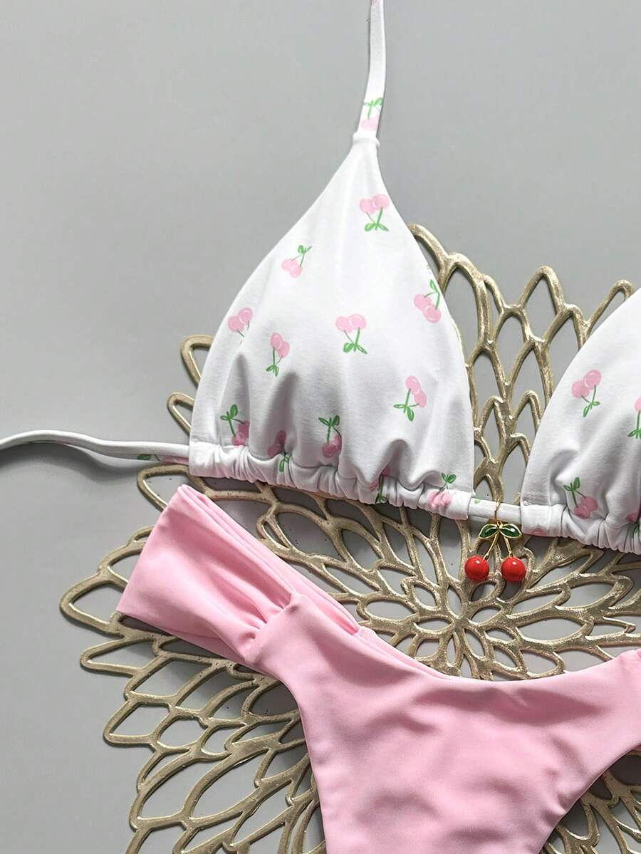 Women's 2-piece triangle cup bikini set in solid color featuring woven pearl shell decoration, halter neckline, and high-waist side-tie ruched bottoms.