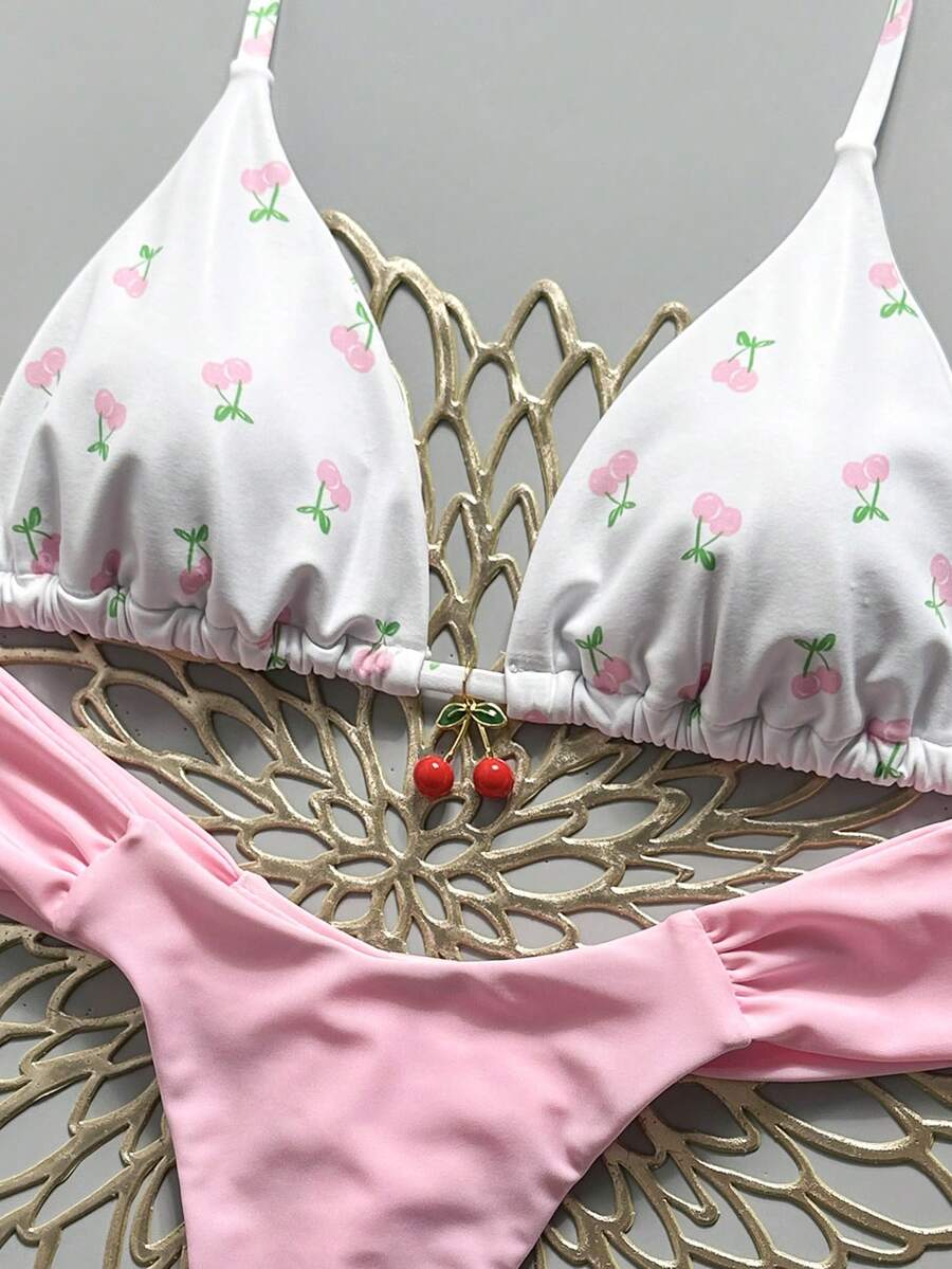 Women's 2-piece triangle cup bikini set in solid color featuring woven pearl shell decoration, halter neckline, and high-waist side-tie ruched bottoms.