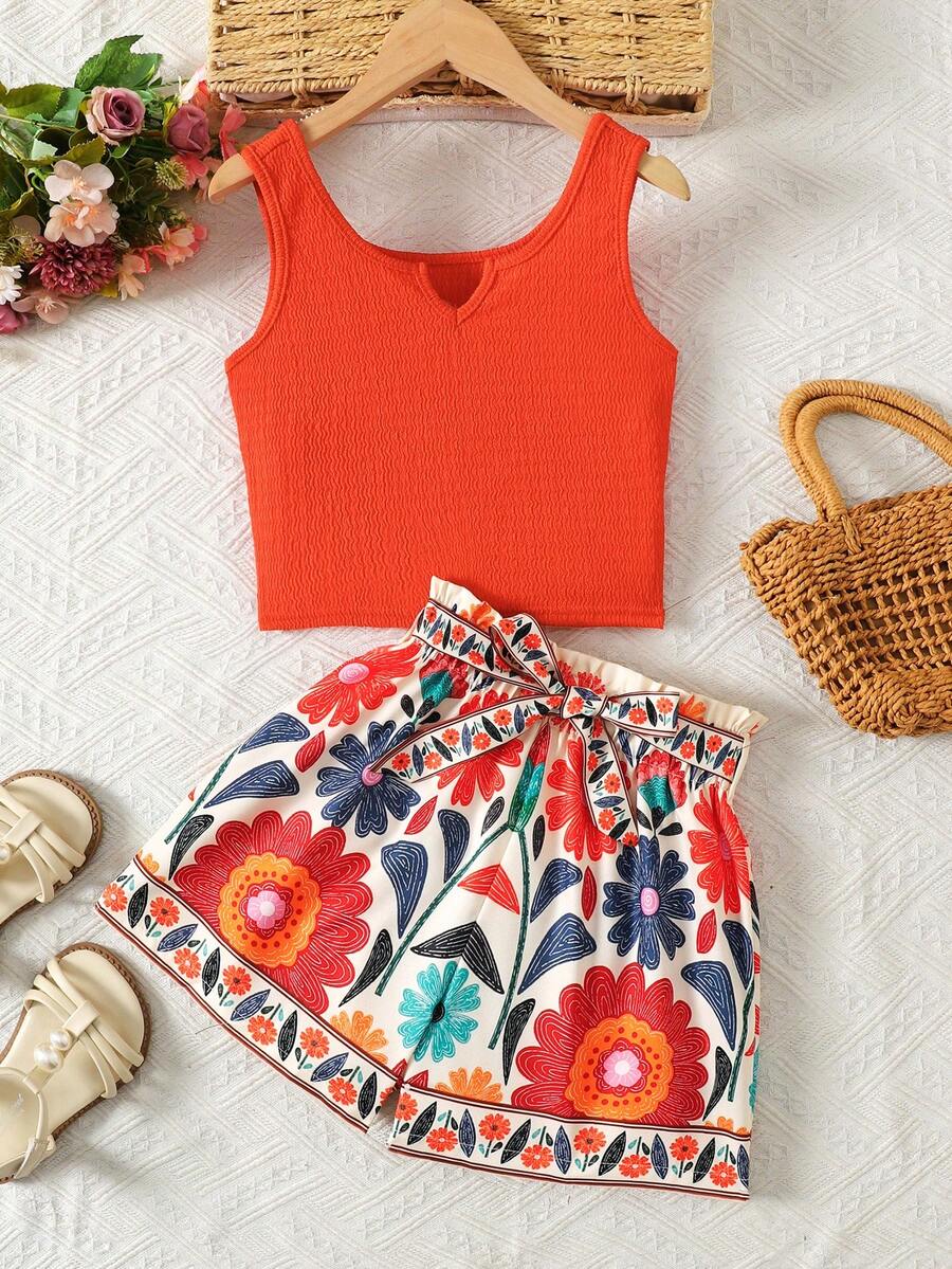 Tween girl wearing a casual 2-piece set featuring a black rib-knit scoop neck tank top and leopard print paperbag waist shorts with a matching belt.