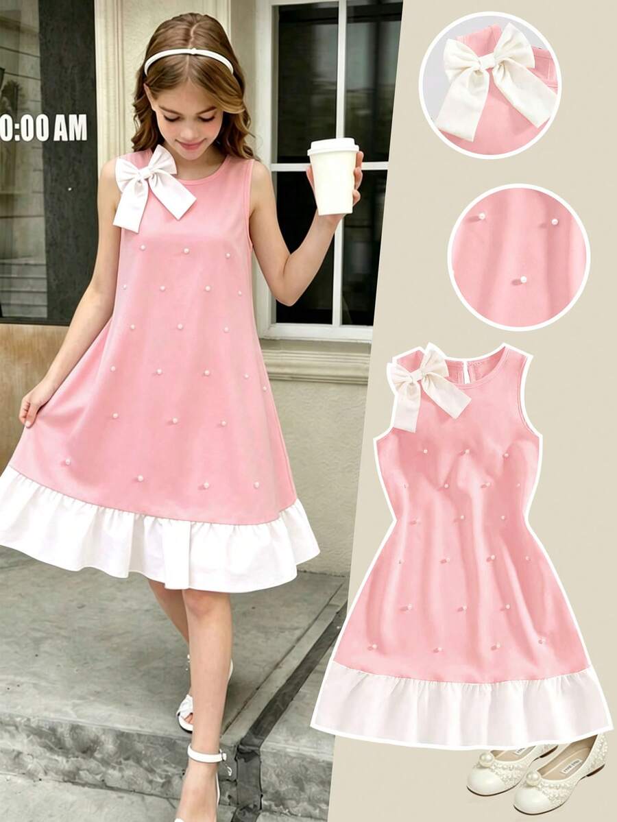Yellow sleeveless colorblock dress for girls featuring a round neck, ruffle hem, and front bow detail.